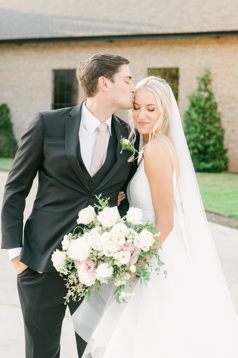 bride and groom outside Iron Manor wedding venue