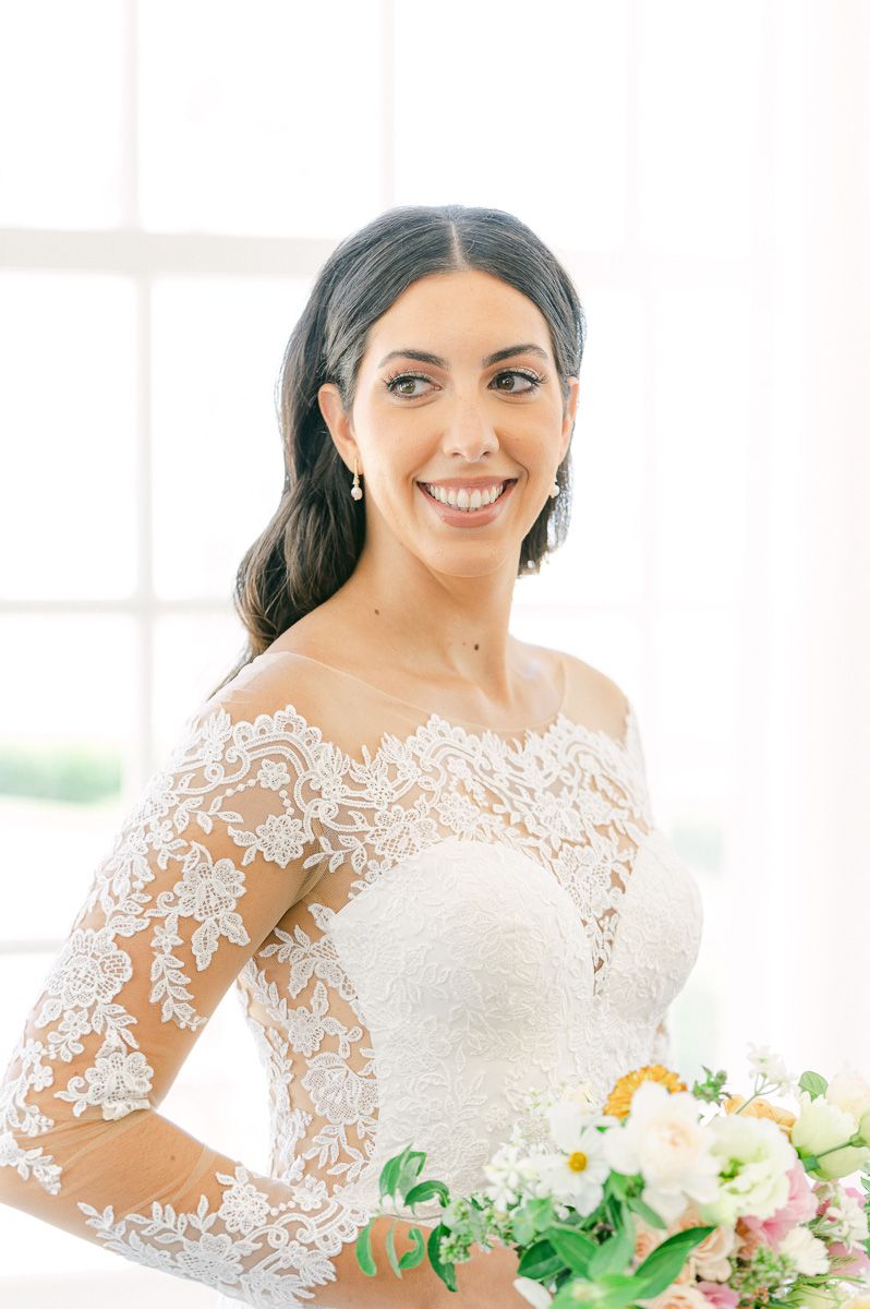 bride holding vibrant spring bouquet
