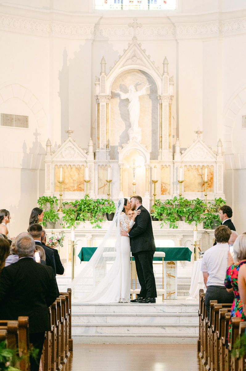 first kiss at Sacred Heart Catholic Church ceremony