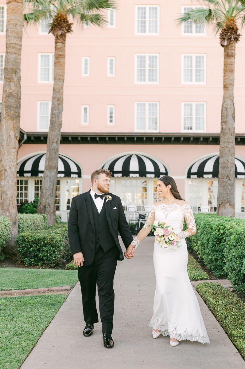 couple walking in front of the Grand Galvez