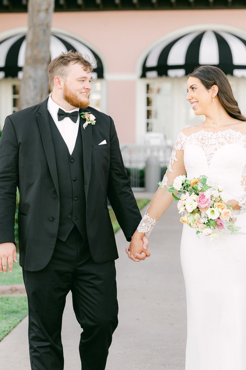 couple walking in front of the Grand Galvez