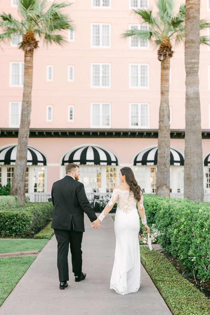 couple walking in front of the Grand Galvez