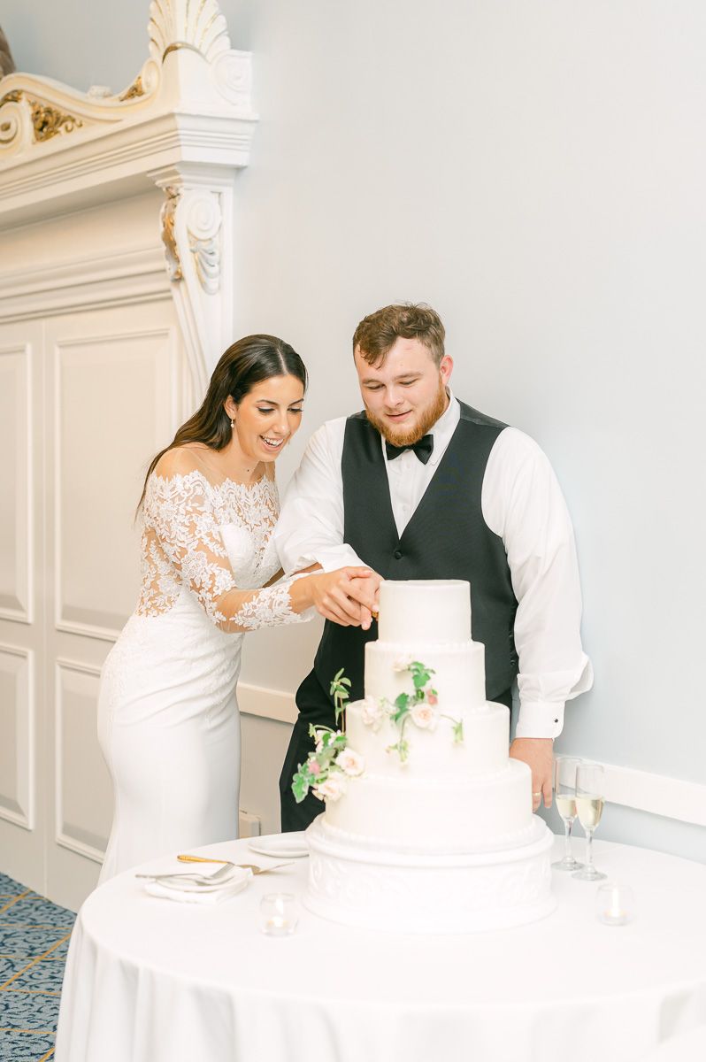 couple cutting wedding cake