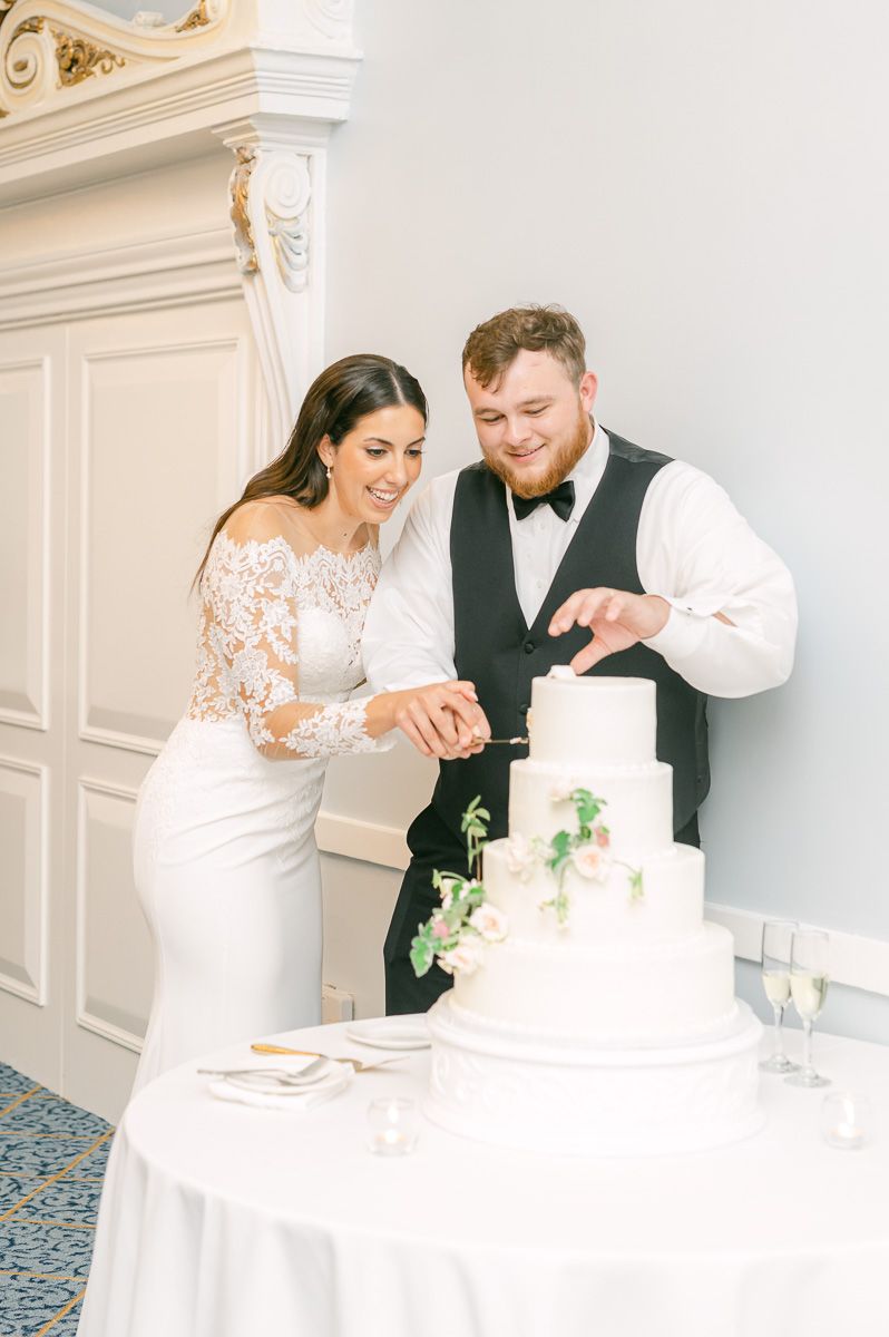 couple cutting wedding cake