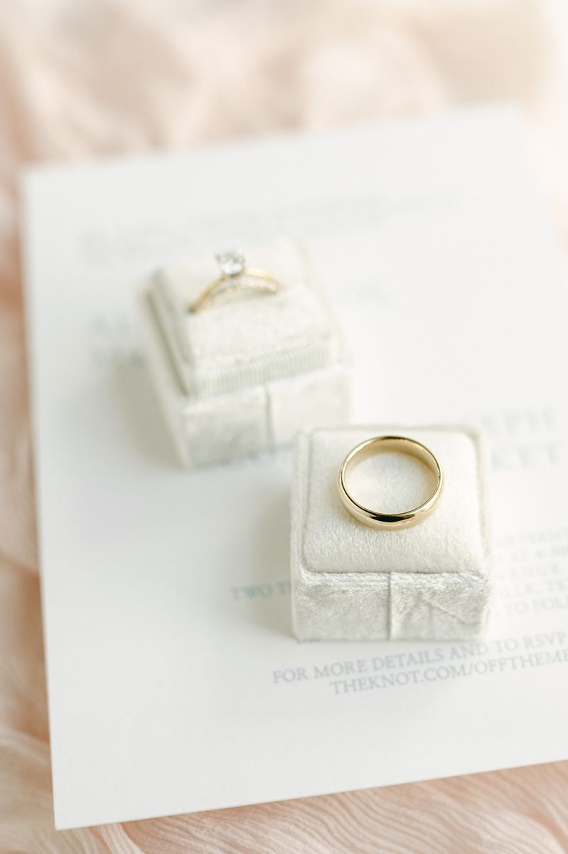wedding rings on pink fabric