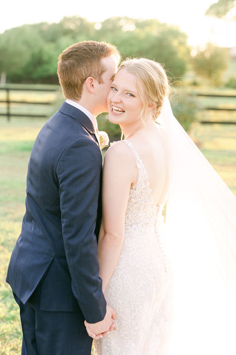 bride and groom cuddling during golden hour