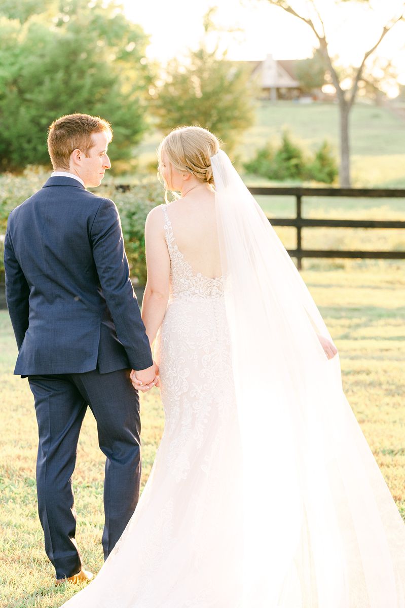 bride and groom walking during golden hour