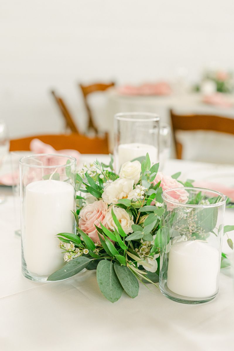 wedding reception decor with pink flowers at Venue 311 Plantersville Tx