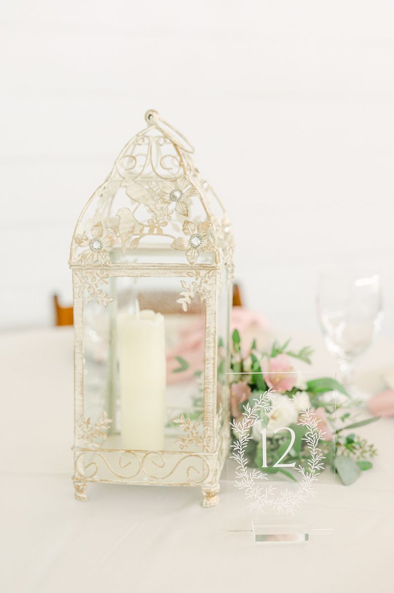 wedding reception decor with white lantern at Venue 311 Plantersville Tx