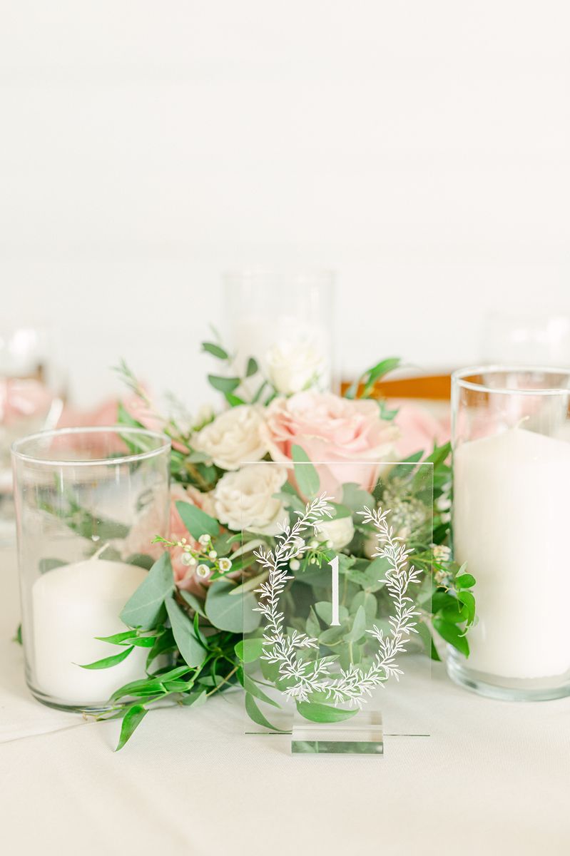 wedding reception decor with pink flowers at Venue 311 Plantersville Tx