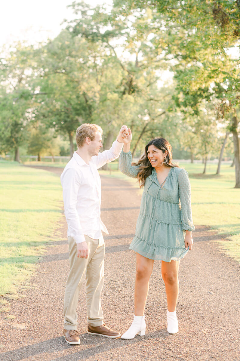 couple dancing during their engagement session in houston