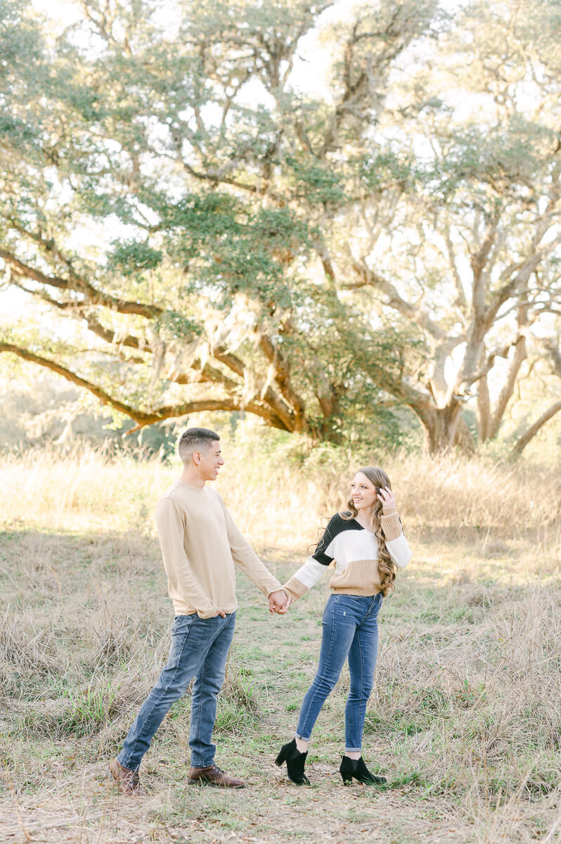 a couple walking at their houston engagement session