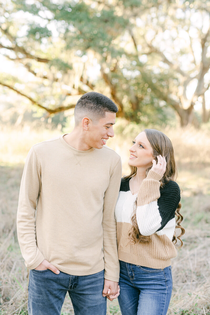 a couple cuddling at their houston engagement session