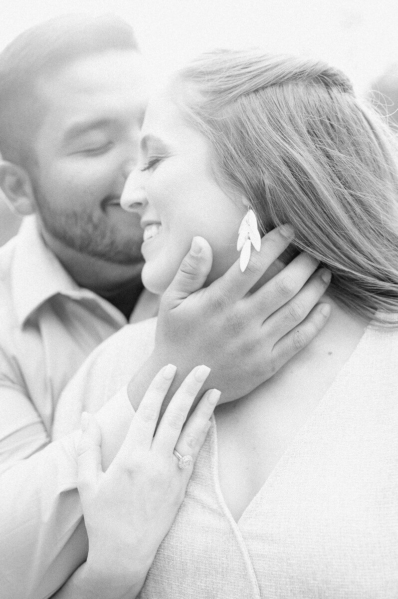 a black and white photo of a couple at bull creek park in Austin