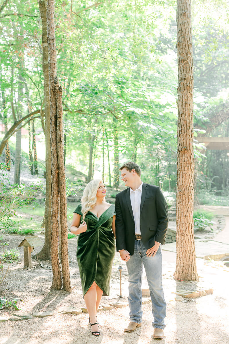 a couple in the trees surrounding big sky barn