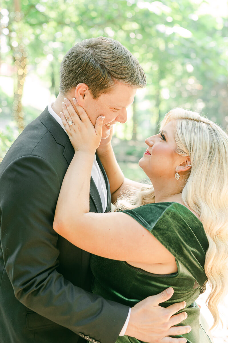 a couple in the trees surrounding big sky barn