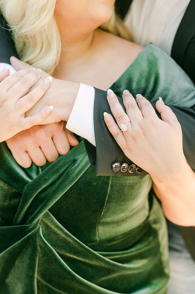 a couple in an emerald dress at big sky barn