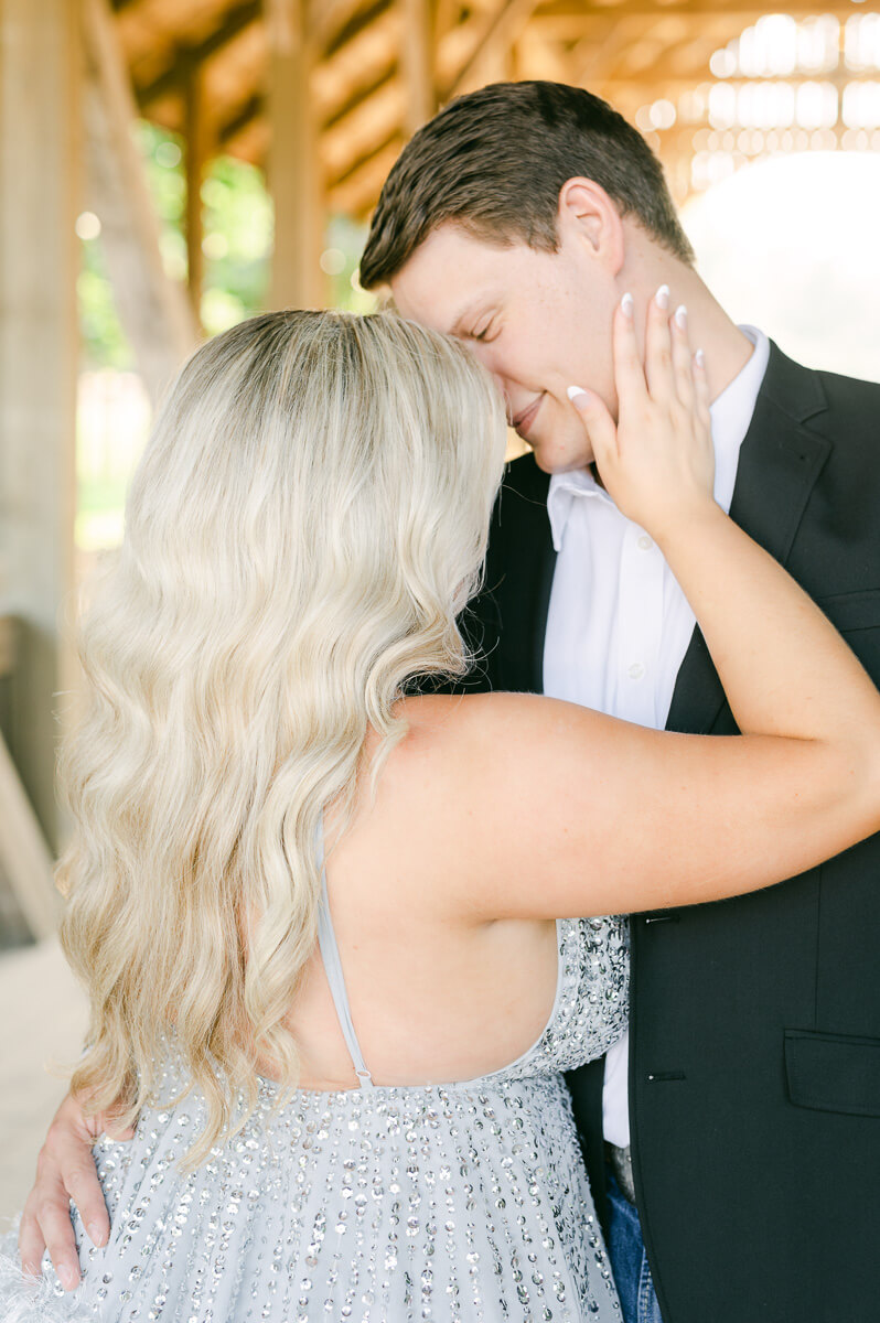 a couple walking on the bridge outside big sky barn