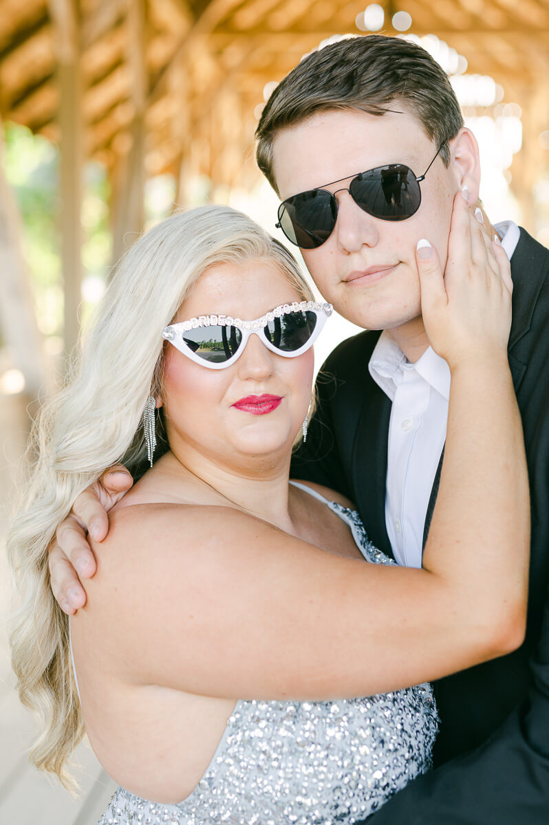 a couple wearing sunglasses outside big sky barn