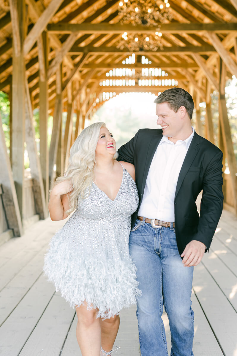 a couple walking outside big sky barn