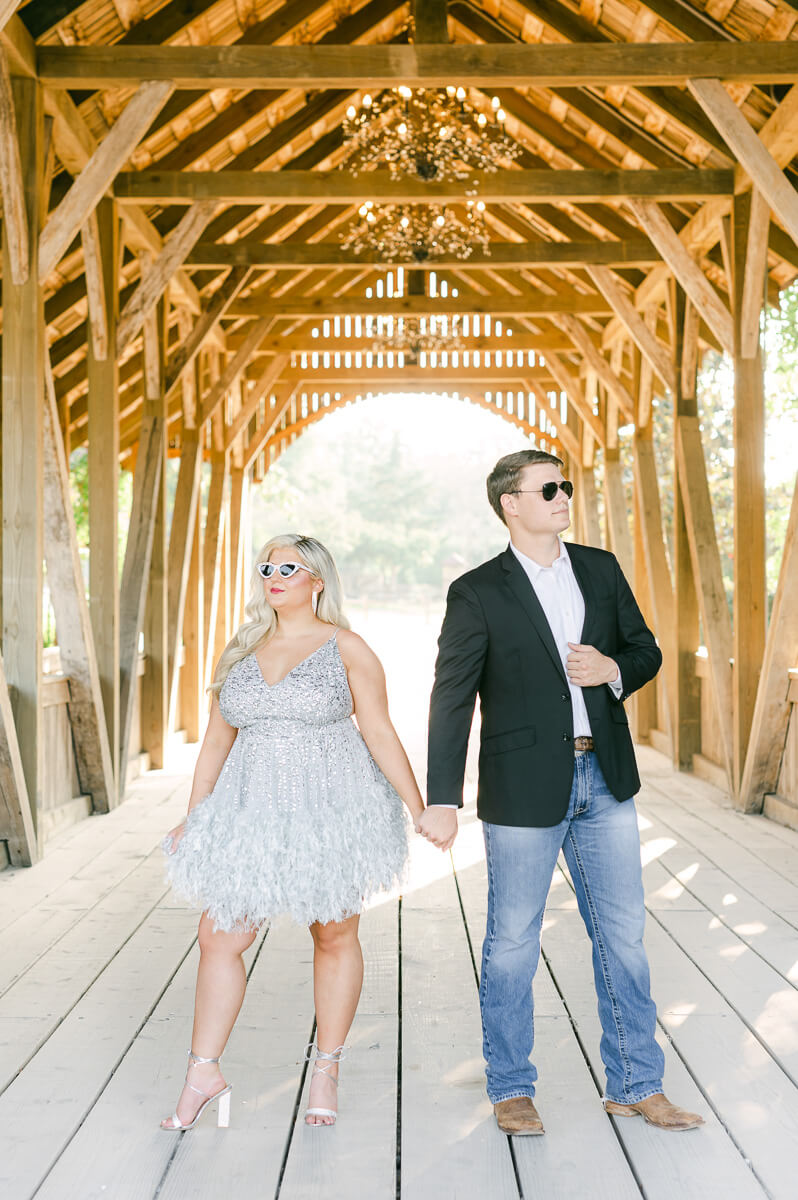 a fun couple wearing sunglasses at their engagement session