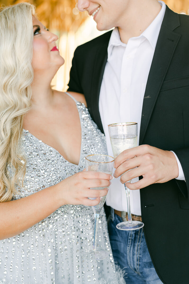 a couple popping champagne at big sky barn 