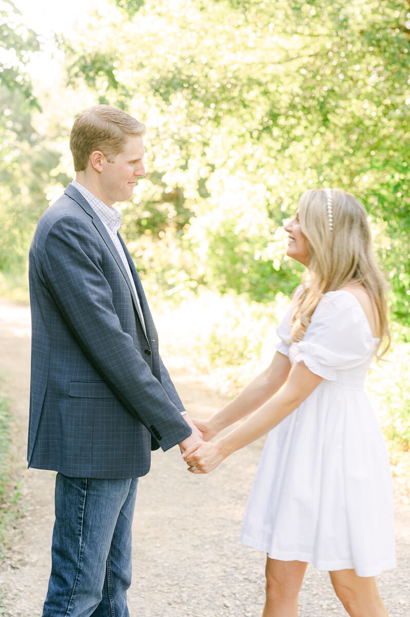 a couple in a white dress and blue suit