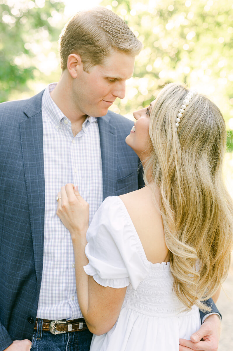 a couple in a white dress and blue suit