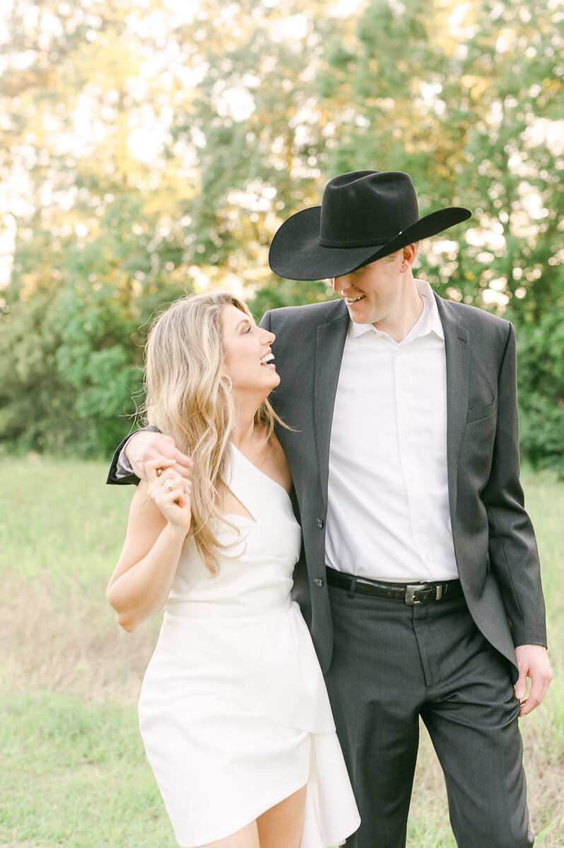 a couple walking at memorial park in houston