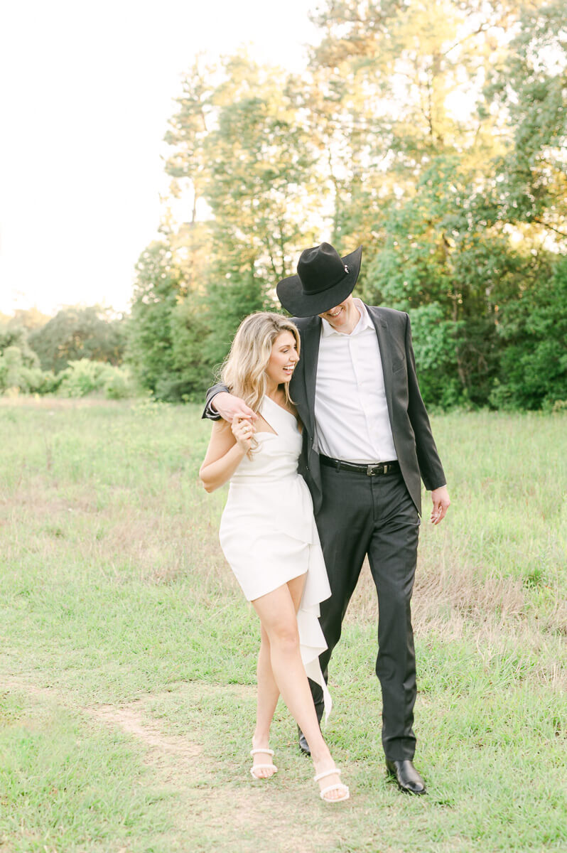 a couple walking at memorial park in houston