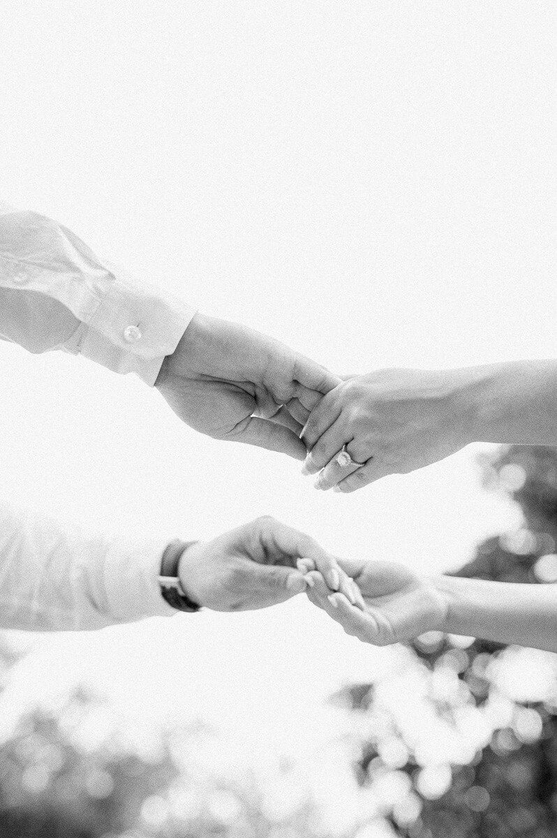 a black and white photo of hands