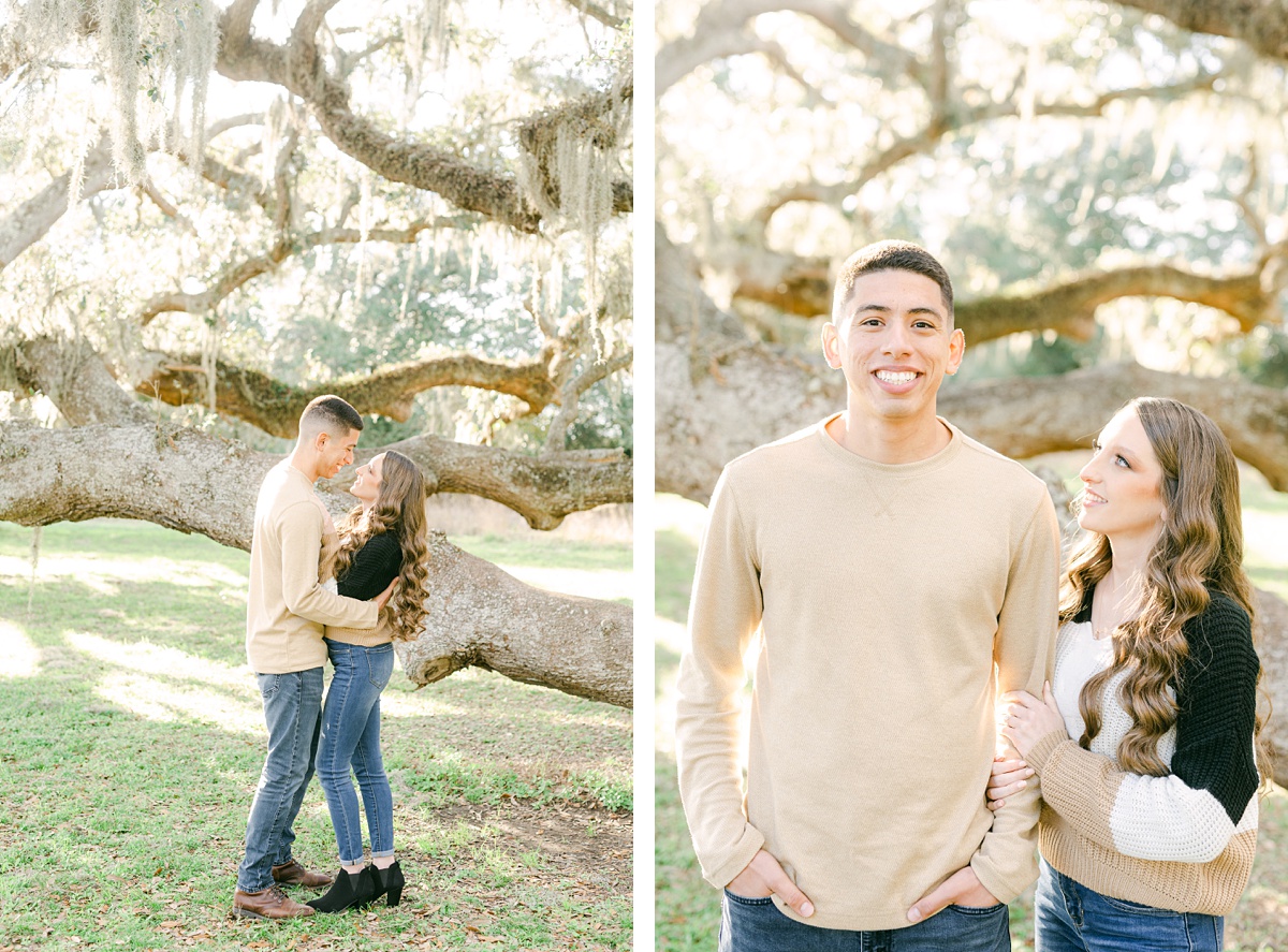 a couple standing in front of a Spanish moss tree