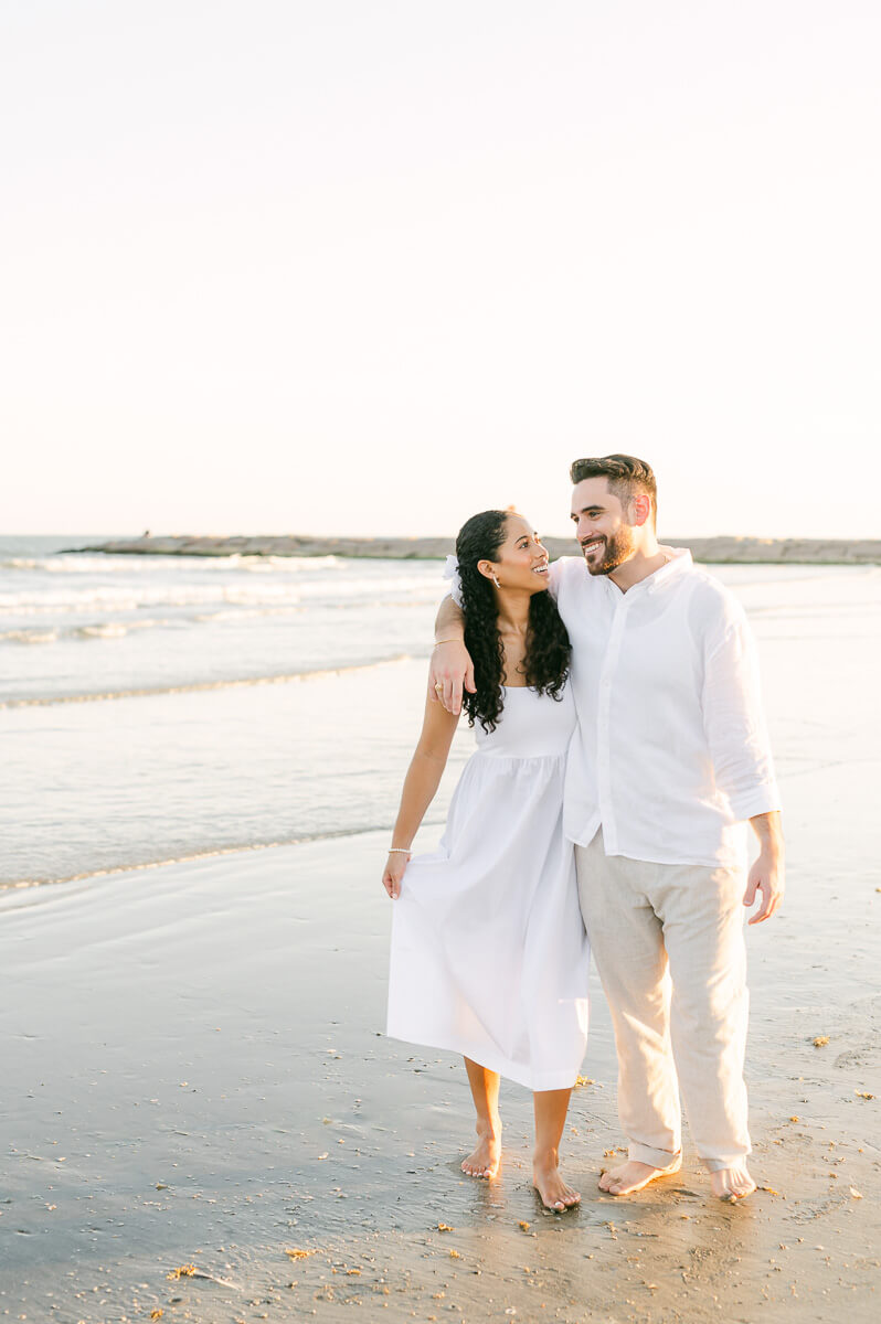 couple on Galveston beach by Houston wedding photographer Eric & Jenn Photography