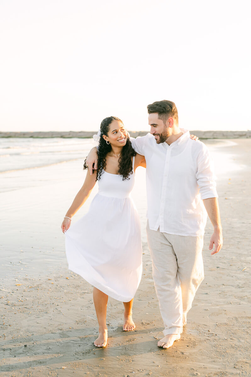 couple at their engagement session on Galveston beach 