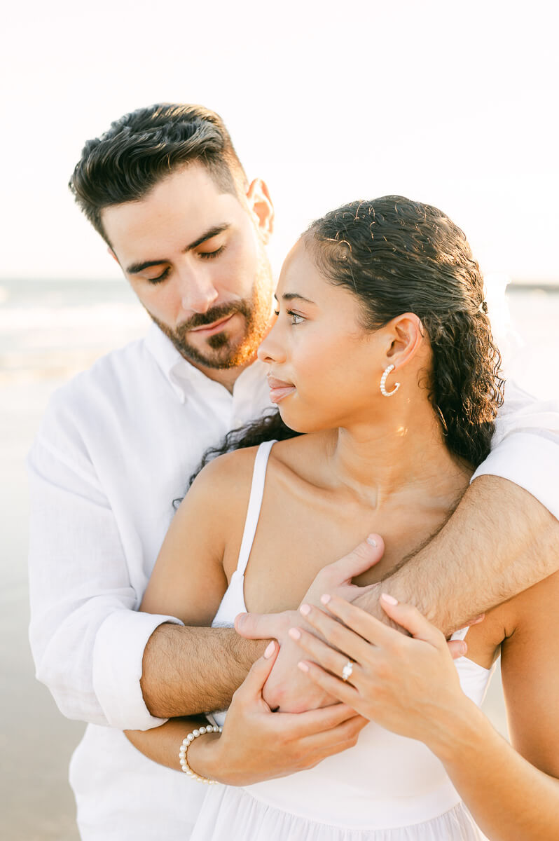 couple at their engagement session on Galveston beach 