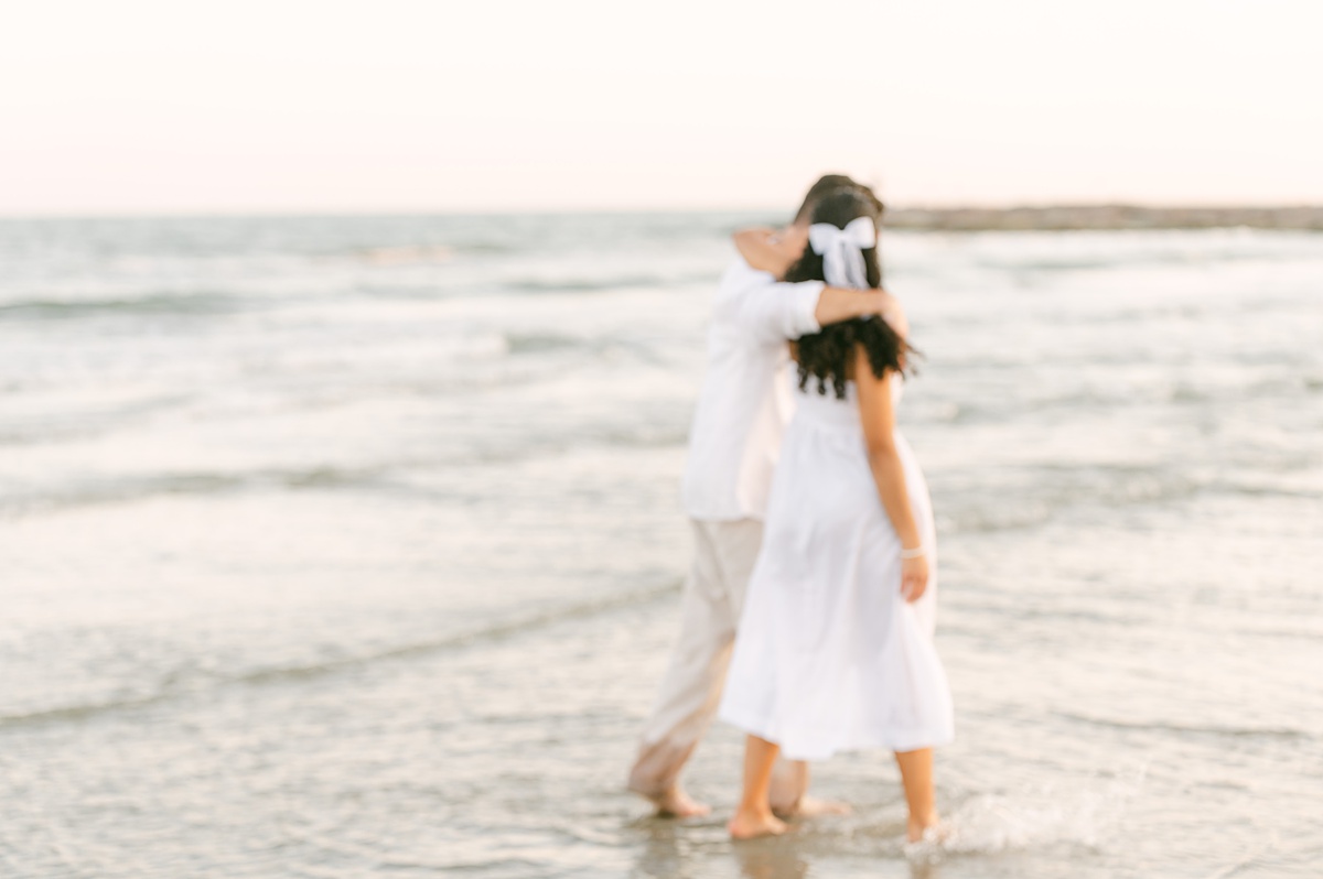 Couple on the beach by Houston wedding photographer Eric & Jenn Photography