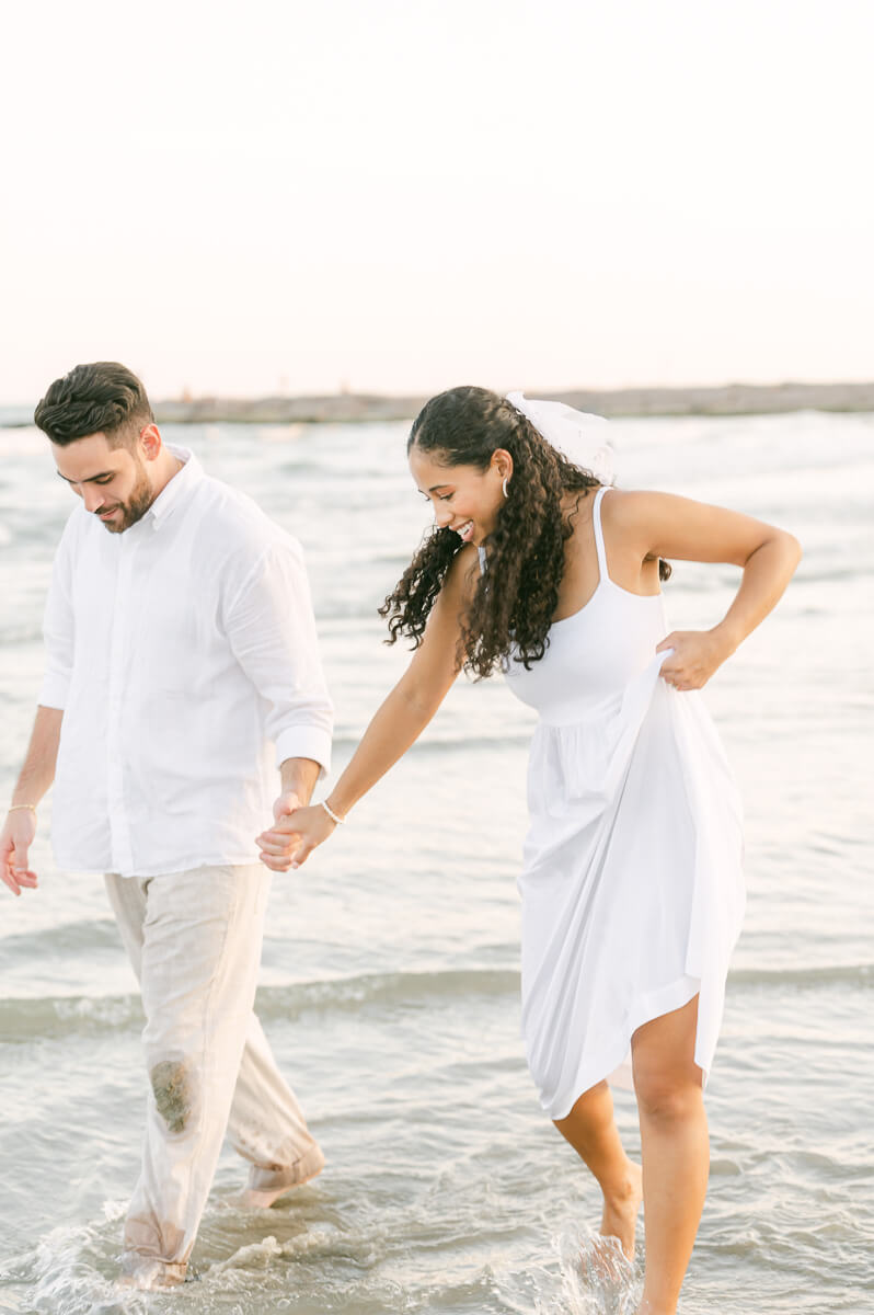 Couple cuddling by Houston wedding photographer Eric & Jenn Photography