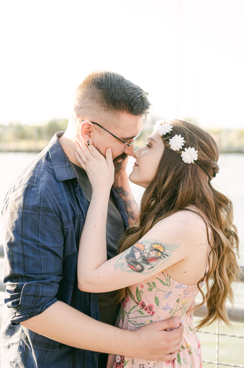 a couplet at their kemah boardwalk engagement session