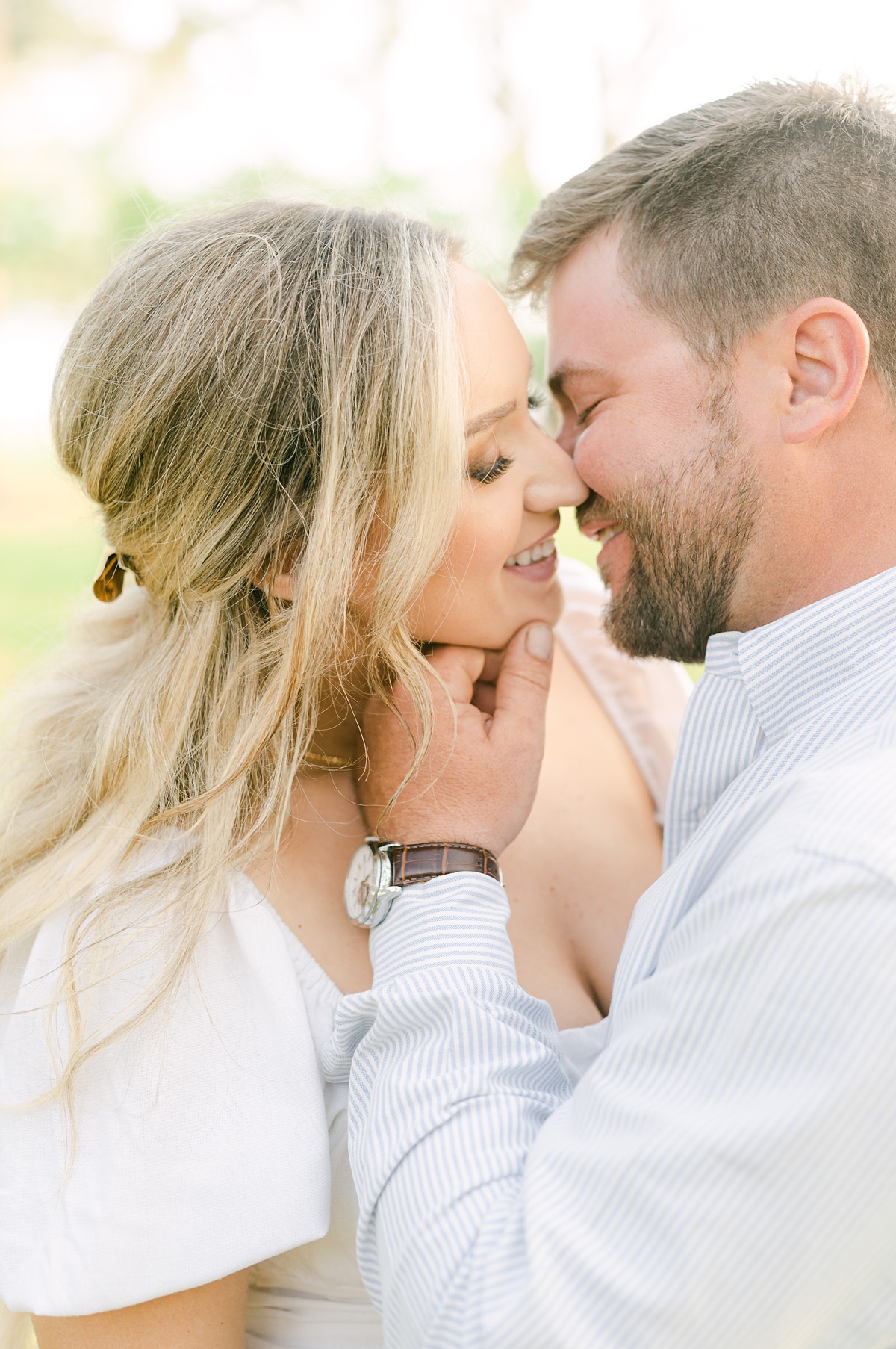 a couple cuddling at their engagement session
