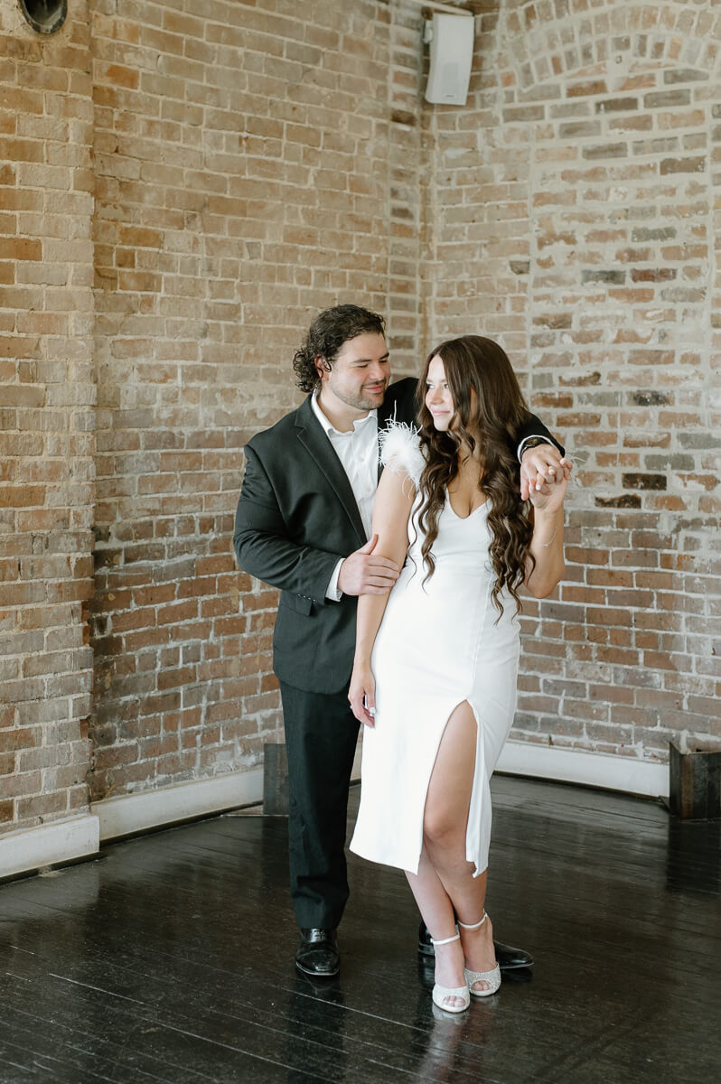 a couple posing for engagement photography at station 3 wedding venue