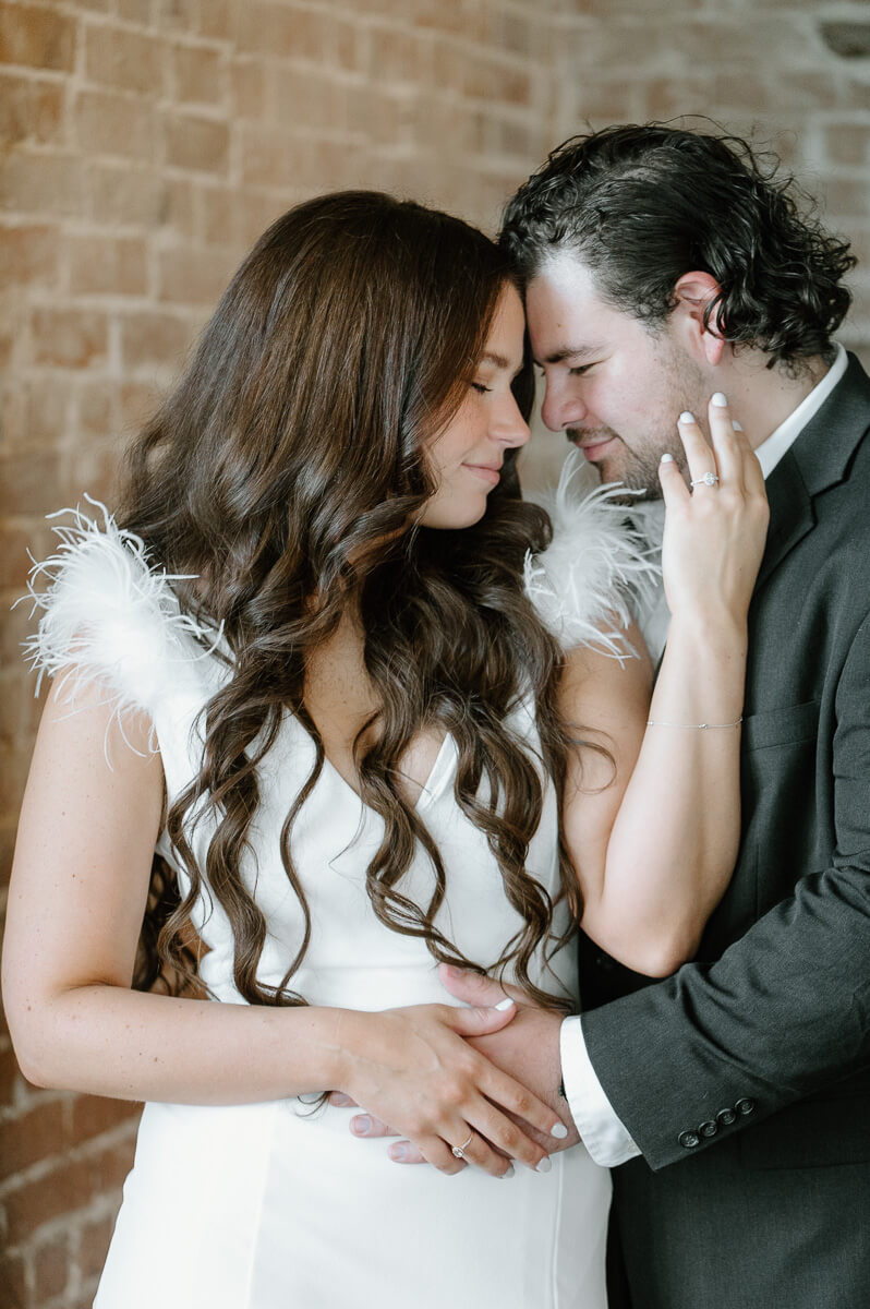 a couple cuddling at their engagement session