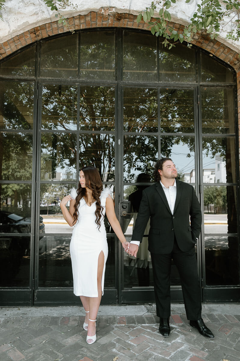 a couple standing outside of station 3 wedding venue