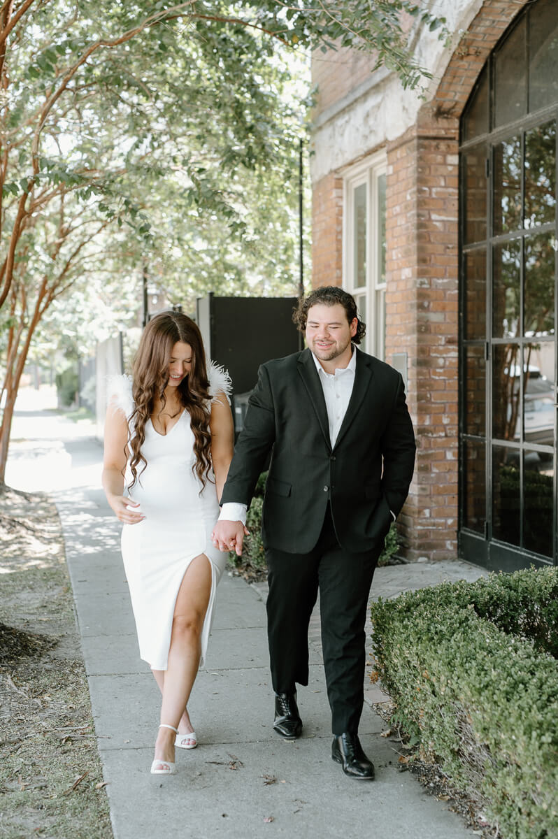 a couple walking outside of station 3 wedding venue