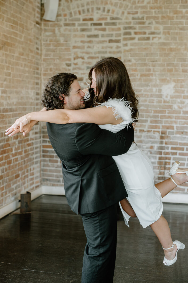 a couple spinning inside station 3 wedding venue