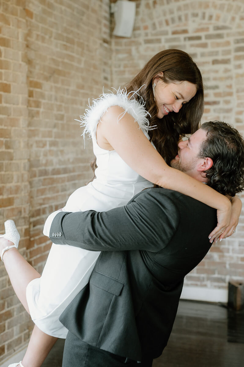 a couple spinning inside station 3 wedding venue