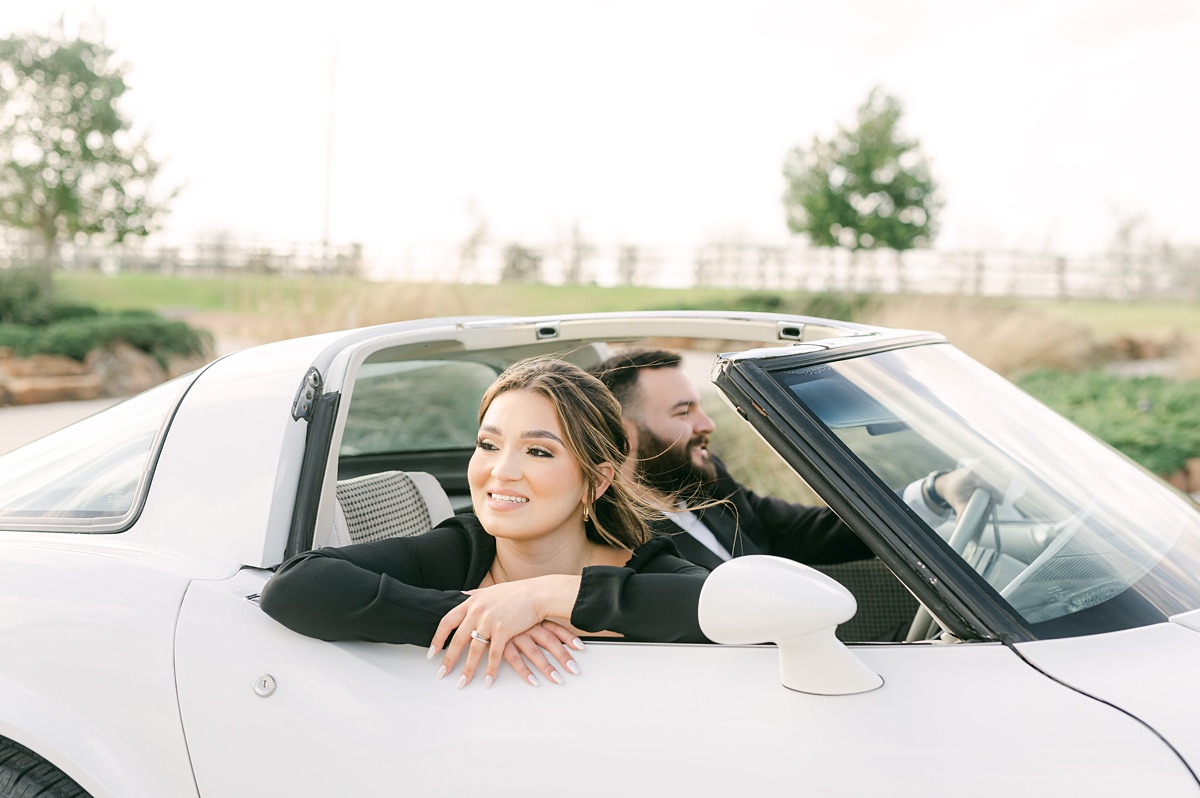 Couple in a vintage car by Houston wedding photographer Eric & Jenn Photography