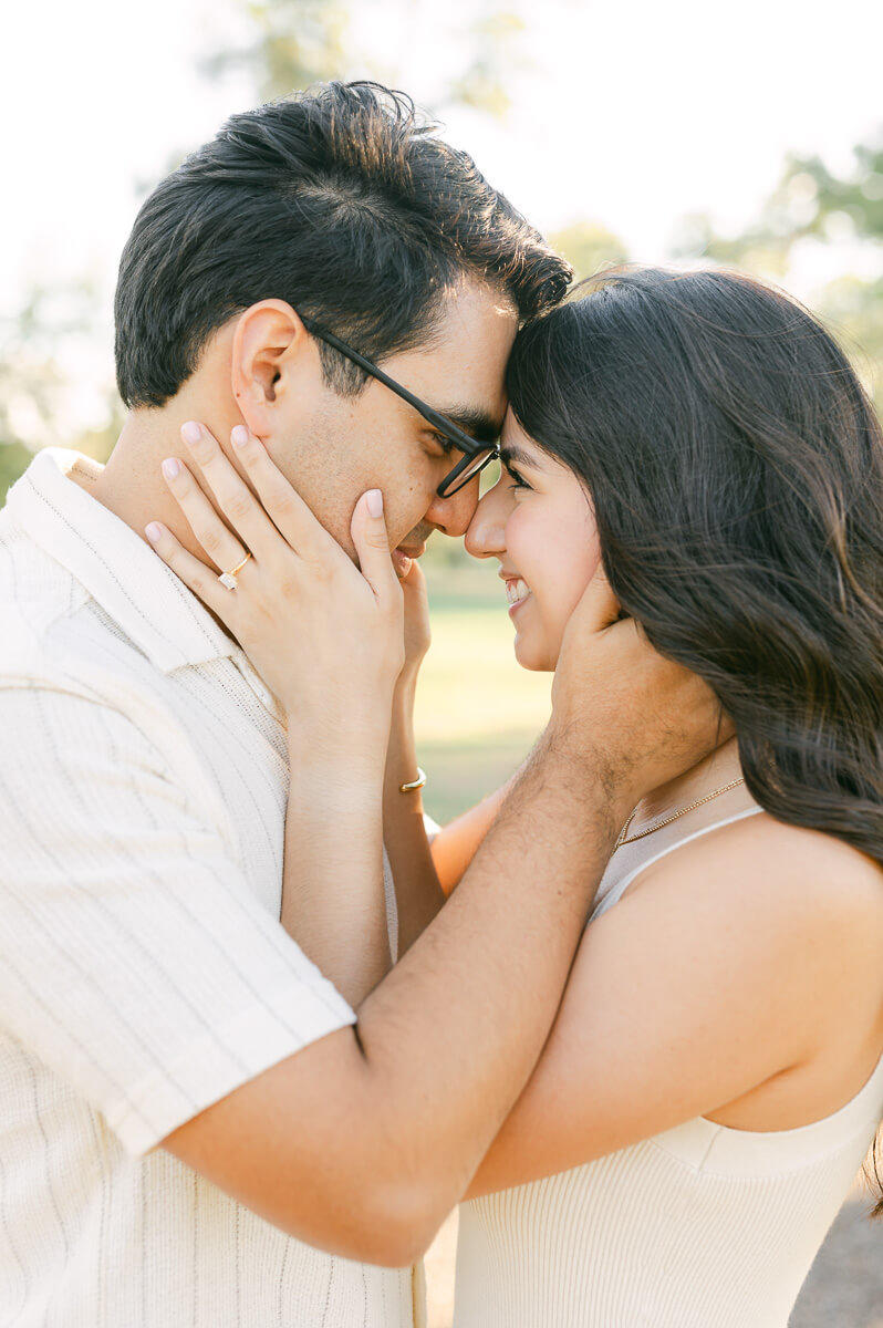 a couple cuddling during their Houston engagement session