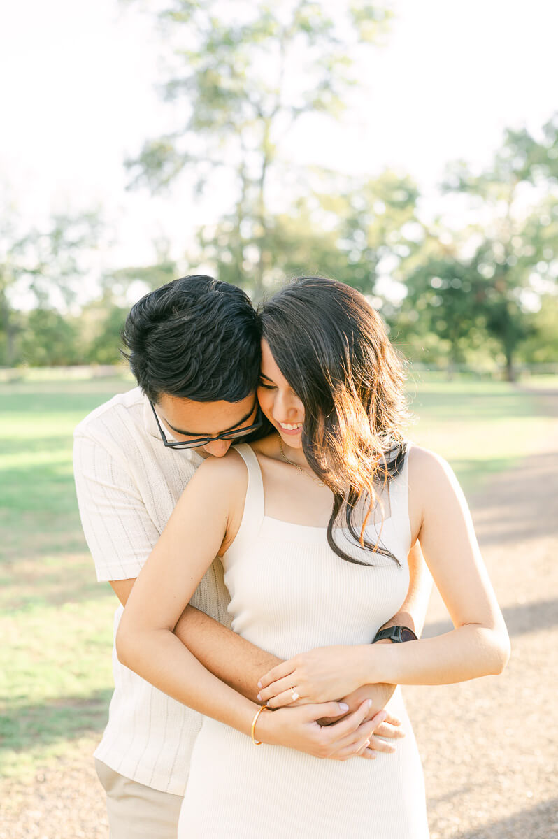 a couple cuddling by Houston wedding photographer Eric & Jenn Photography