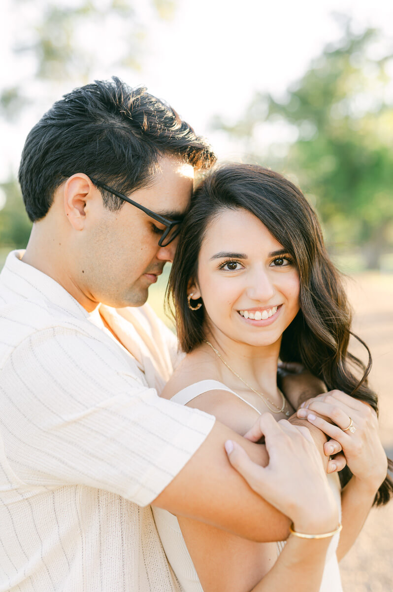 a couple cuddling by Houston wedding photographer Eric & Jenn Photography