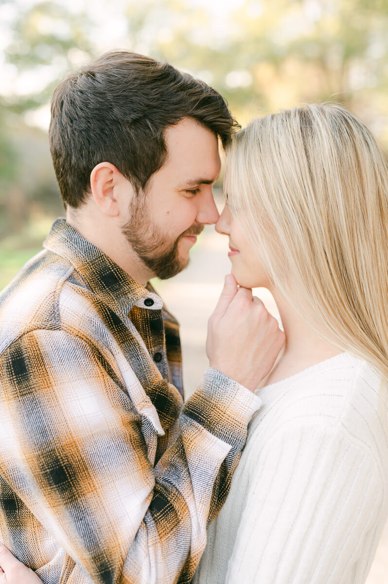 groom cupping his bride's chin